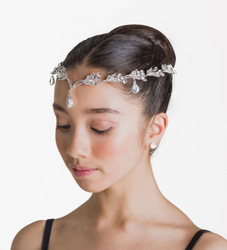 Large hairpiece on headband with droplet embellishments.