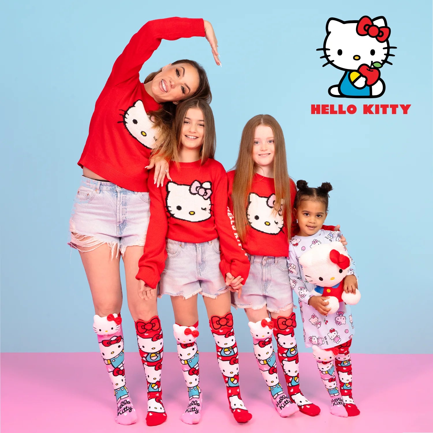 Hello Kitty knee high socks by MADMIA with 3D plush character head and red bow design