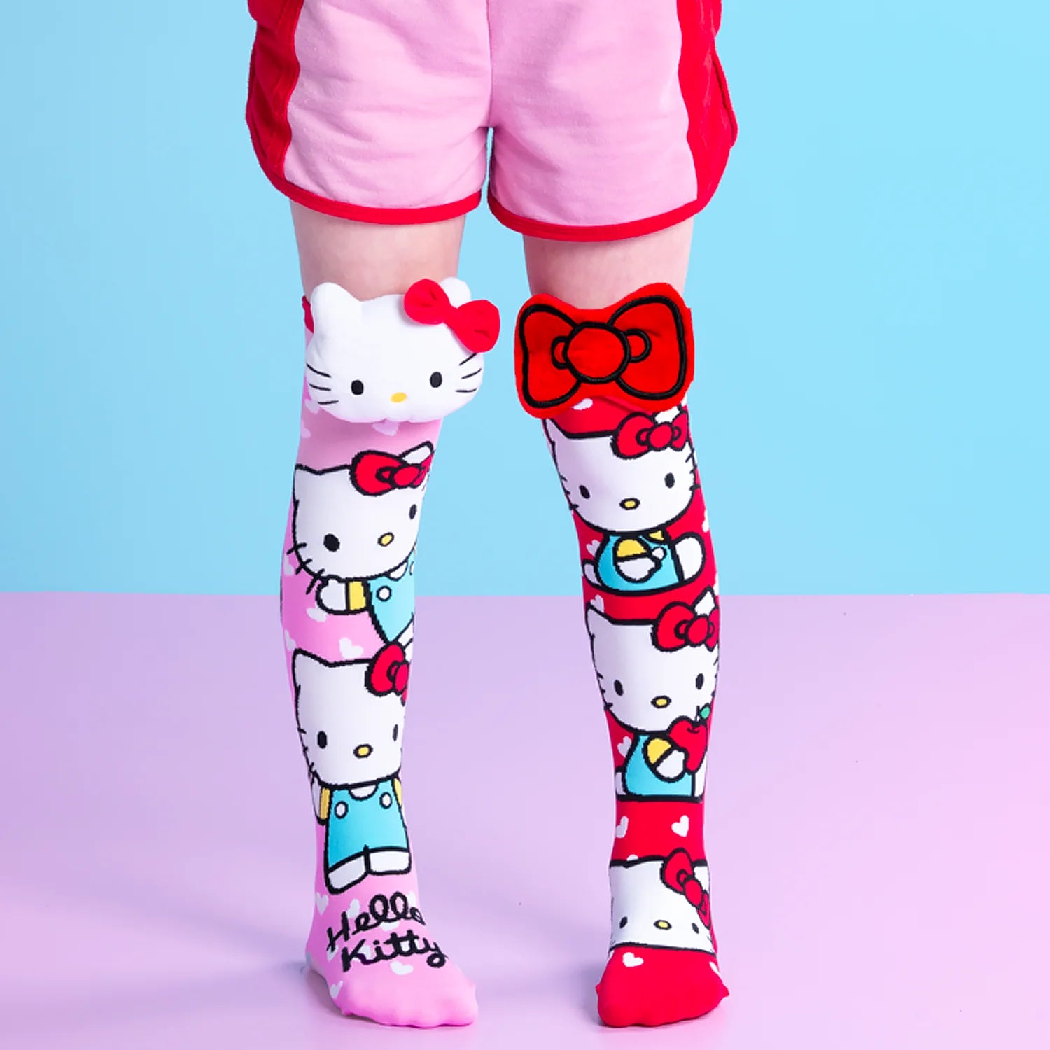 Hello Kitty knee high socks by MADMIA with 3D plush character head and red bow design