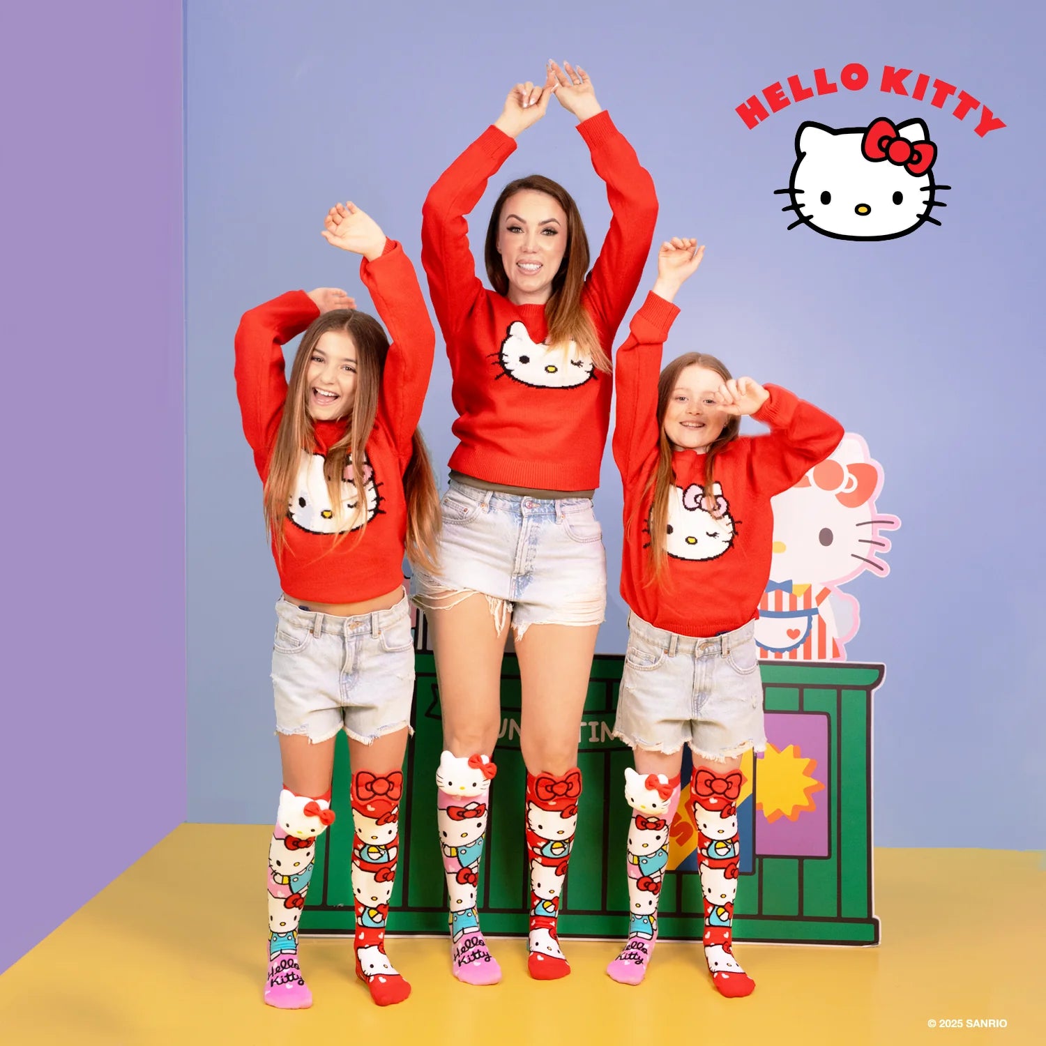 Hello Kitty knee high socks by MADMIA with 3D plush character head and red bow design
