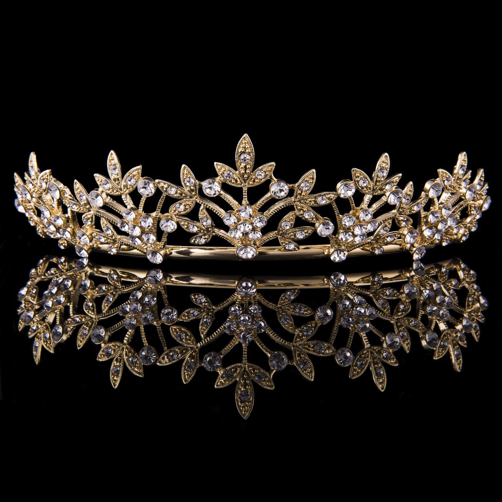 gold tiara gold with large crystals centred and smaller sparkling crystals at each end.
